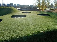 Trampoline for toddlers on a soft hill made of artificial turf in Baakenpark Hamburg