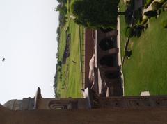 View of Raja Harsh ka Tila site through an ancient tomb's arch