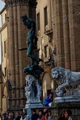 Piazza della Signoria ESE view featuring Perseo con la testa di Medusa by Benvenuto Cellini and Lion sculpture by Flaminio Vacca