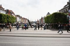 Nyhavn harbor in Copenhagen, Denmark with colorful buildings and boats along the water