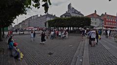 statue in a square with buildings in the background in Copenhagen