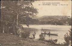 Vintage postcard of Gérardmer Lac in France featuring boats on the water and tree-lined shores