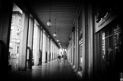 a black and white photo of a photographer in Novara, Italy