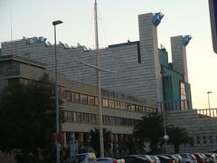 Escuela Superior de la Marina Civil in the foreground with the Palacio de Festivales de Cantabria in the background