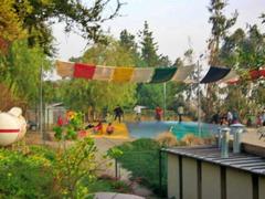 Children playing on an inflatable game at Parque Mahuida, La Reina, Santiago, Chile, 2009