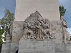 The Allegory of Sacrifice sculpture by Ignacio Asúnsolo on the right facade of the Álvaro Obregón Monument