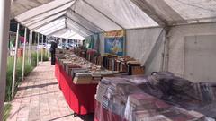 books for sale at a market stall