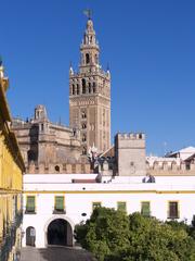 Courtyard with flags and the Giralda tower in the background