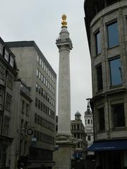 Cityscape of London with prominent buildings and cloudy sky