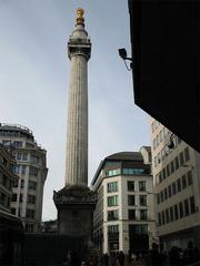 The Monument to the Great Fire of London surrounded by modern buildings