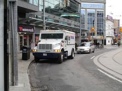 Armoured car for cash deliveries at 10 Dundas Street East