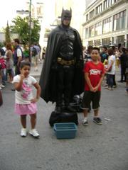 Batman taking a photo in Dundas Square, Toronto, Ontario, Canada