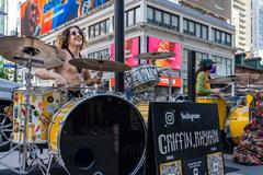 Griffin Rhythm and Plastic Heart Surgery performing at Dundas Square