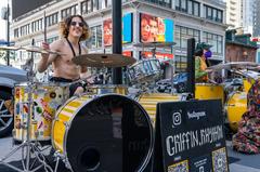 Live performance at Dundas Square featuring 'Griffin Rhythm' and 'Plastic Heart Surgery'