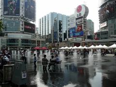 Dundas Square in Toronto bustling with people and illuminated by bright billboards