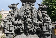 Pedestal of a street lamp in Plaza de Bib-Rambla, Granada, Spain