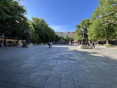 Plaza Bib Rambla in Granada with people walking and historical architecture