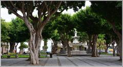 Plaza del Adelantado with marble fountain and surrounding historic buildings