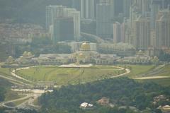 Panoramic view of Kuala Lumpur skyline featuring iconic buildings like the Petronas Twin Towers