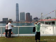 Victoria Harbour view from Ocean Terminal rooftop in Tsim Sha Tsui, featuring Xue Long 2 in April 2024