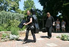 Musicians leaving wedding at J. C. Raulston Arboretum