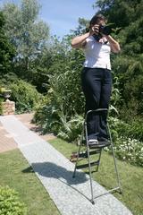 Photographer on a step stool at a wedding