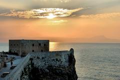 sunset over Rethymnon Fortress in Crete, Greece