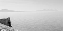 panoramic view of Crete island coastline with blue sea and partly cloudy sky