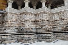 Intricate sculpted friezes on the exterior walls of Jagdish Temple in Udaipur, Rajasthan, India