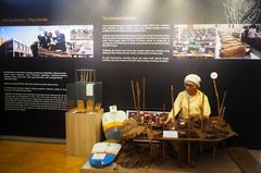 woman sorting tobacco using papan nibung at Indonesian Plantation Museum in Medan