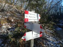 Signpost for Club Alpino Italiano (CAI) trails 110-122 in Bologna