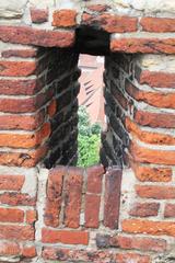 medieval arrow slit in historic Prague building