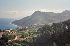 view of Banyalbufar village with terraced landscapes and sea in the background