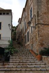 Banyalbufar street view with stone buildings and blue sky