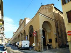 Facade of Don Mazza college in Padua featuring Sant'Antonio Abate church and portico by Andrea da Valle