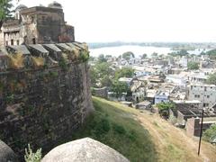 view of Dhar from fort with historical structures and lush greenery