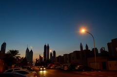 Dubai cityscape before dawn with prominent skyscrapers and illuminated buildings