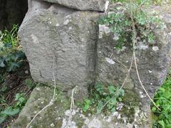 Closeup of Aqua Claudia stones with a half-round hole near Romavecchia in Rome