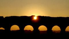 sunset view of the Aqua Claudia aqueduct in Rome