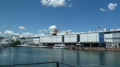 Genoa Aquarium resembling a giant ship with the Biosphere in the background