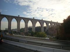 Ancient stone aqueduct in a scenic sunny landscape