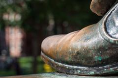 John Harvard statue foot in Harvard Yard