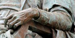 John Harvard Statue showing arm and hand in Harvard Yard