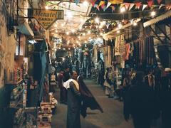 Busy street market in Esna, Egypt with vendors and shoppers