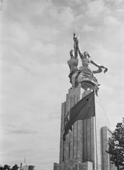 Front view of the Soviet Union pavilion with statue group and national flag at the Paris World Fair 1937