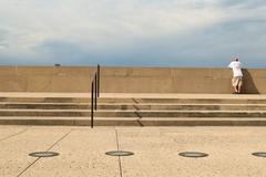 Man looking over a wall at National World War I Museum and Memorial in Kansas City