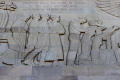 wounded soldiers being led towards the figure of Peace at the center of the Great Frieze