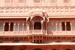 Detail with jharokha on a facade in the main courtyard of Karan Mahal at Junagarh Fort, Bikaner, Rajasthan, India