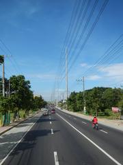 road leading to Nasugbu, Batangas with vehicles and scenic surroundings