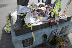 Freddie Mercury statue adorned with flowers and messages in Montreux